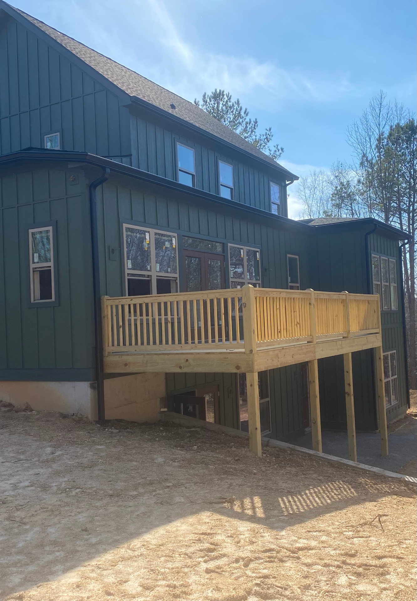 Board and batten home with new gutters